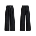 Drooping straight-leg suit pants in black with button open line design and high-waisted fit