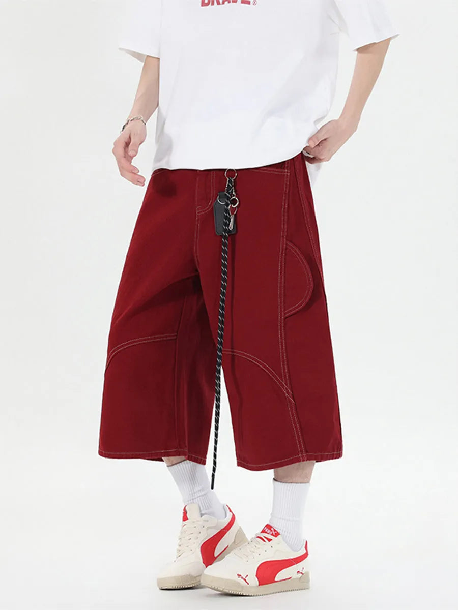 Black wide leg denim shorts with multiple pockets and cropped length on a mannequin