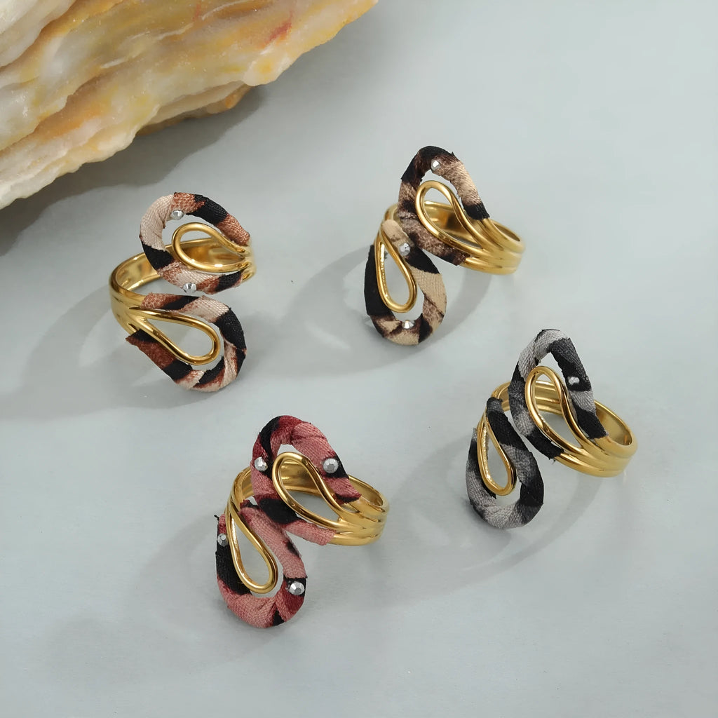 Stainless steel open mouth ring with leopard print geometric shapes in multiple colour options