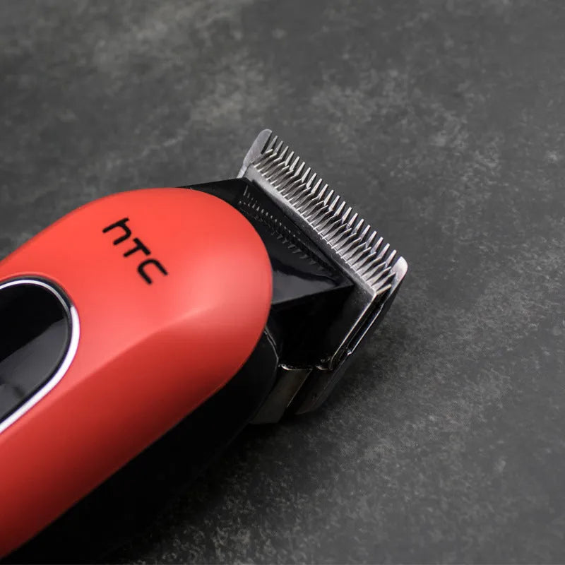 Professional digital electric hair clipper with charger, combs, and accessories in black, red, or white colour.