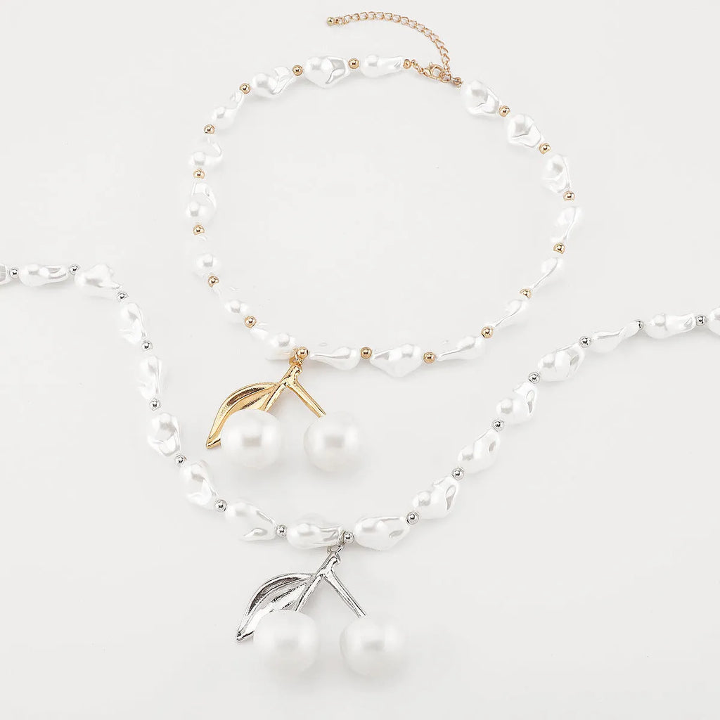 Women's creative pearl necklace with geometric fruit pendant in gold or white finish options