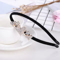 Rhinestone bow headband for women with metal alloy frame and three-dimensional flower decoration