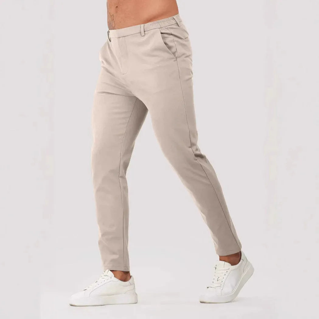 Men's solid colour suit trousers in mid waist, straight leg, small feet opening, polyester blend, available in five colours.