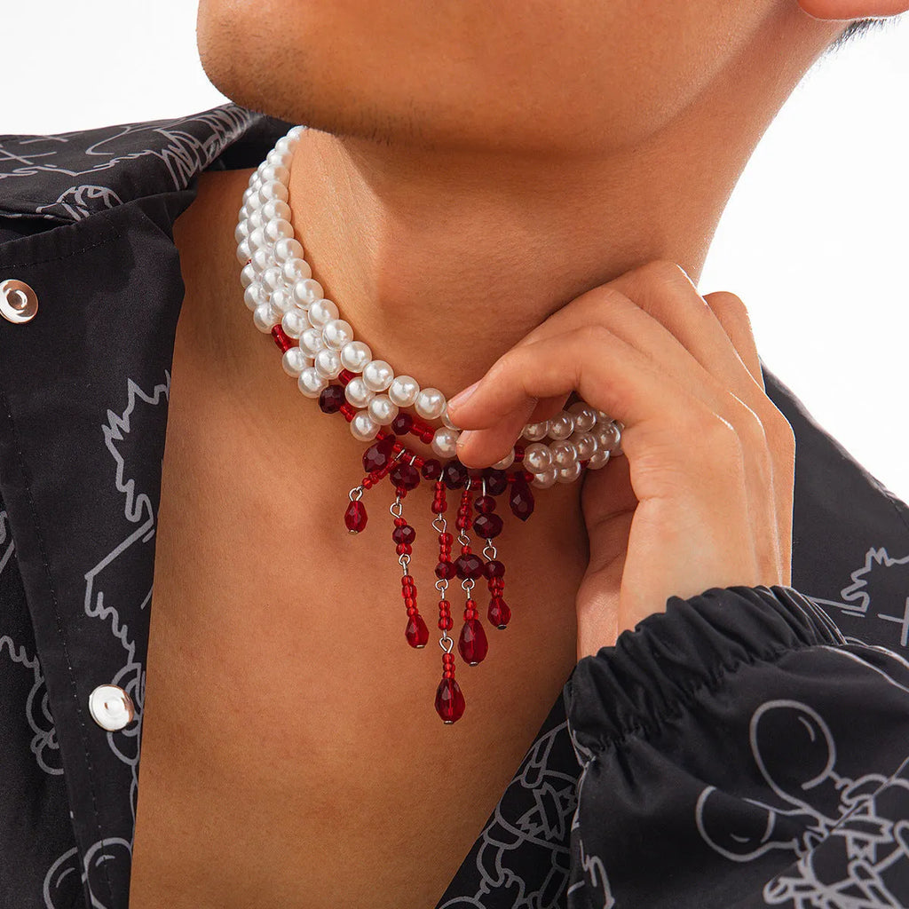 Men's blood drop tassel necklace with geometric crystal pendant and imitation pearls on a chain.