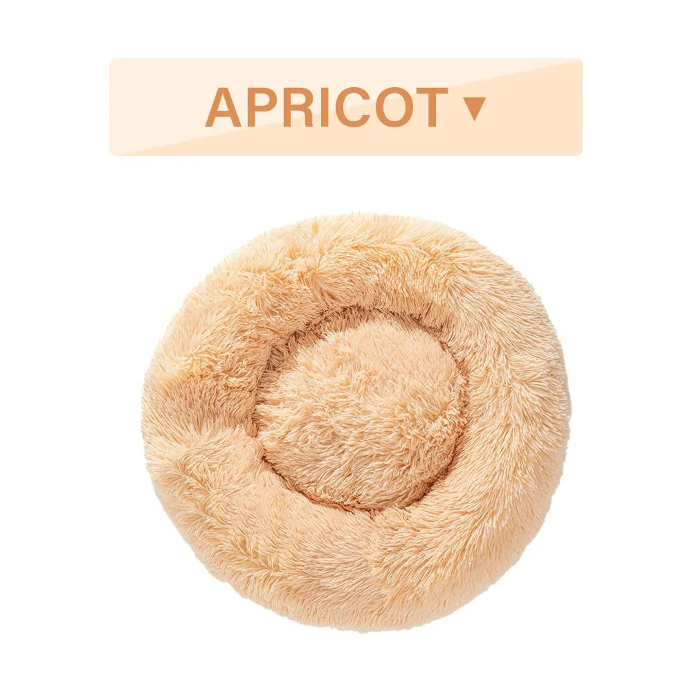 Fluffy donut-shaped pet bed in long plush fabric, shown in a grey colour