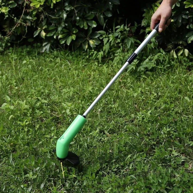 Cordless Zip Trim lawn trimmer with extension pole and protective shield on a garden lawn