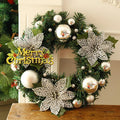 A multicolour plastic Christmas wreath with a 30cm diameter, shown in one of six colour options.