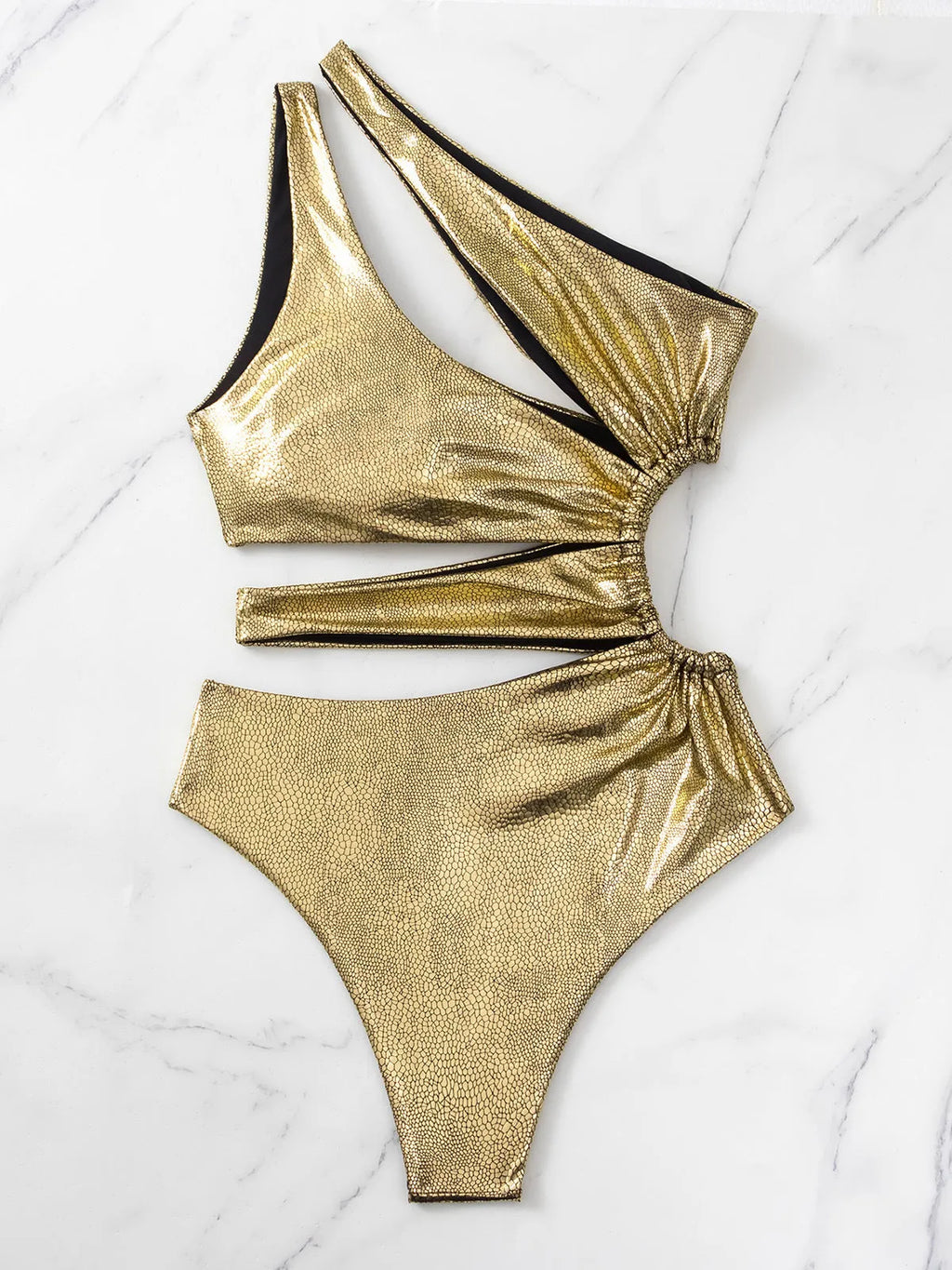 Women's gold backless one-piece swimsuit with sleeveless design for swimming activities