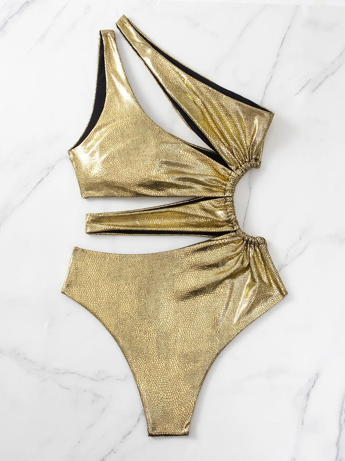 Women's gold backless one-piece swimsuit with sleeveless design for swimming activities
