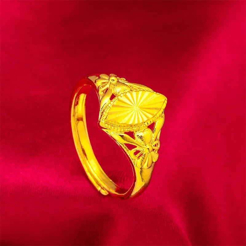Electroplated gold brass ring with geometric open diamond floral design and textured detailing