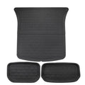Set of four textured TPR floor mats for a Tesla Model Y, showing foot mats and storage box mats.