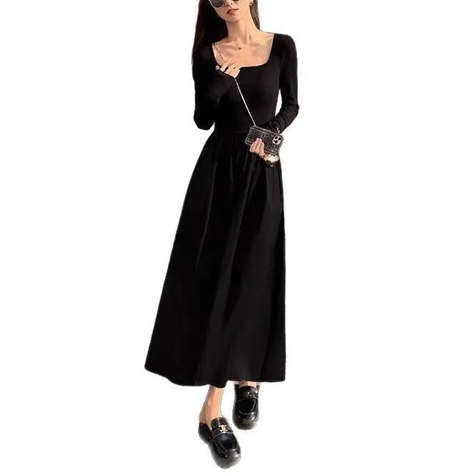 Women's black square collar knitted A-line dress with long sleeves and elastic waist.