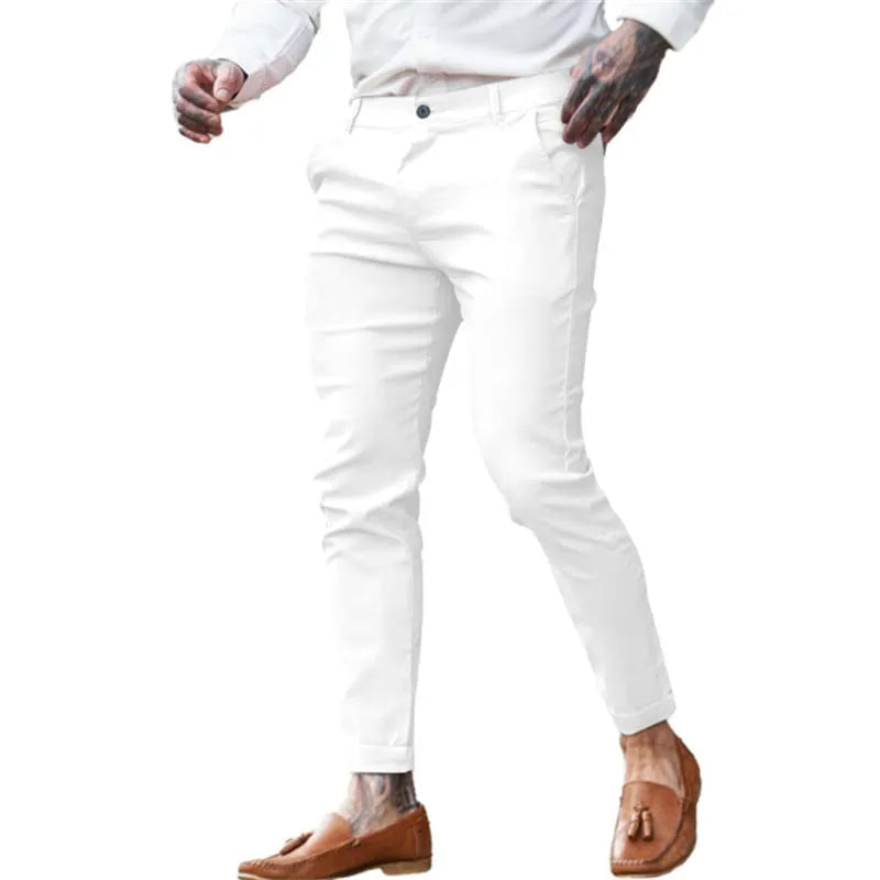 Men's slim fit stretch cotton pencil pants in a solid colour on a model.