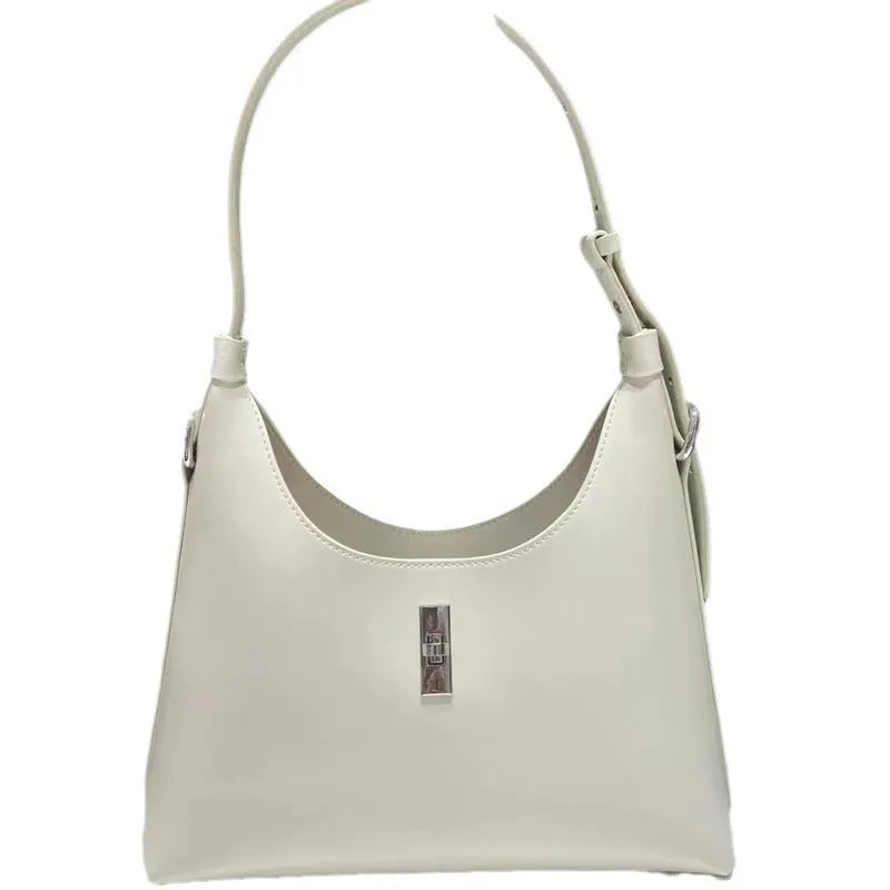 Soft genuine leather crossbody shoulder bag in dumpling shape with internal phone pocket and change compartment