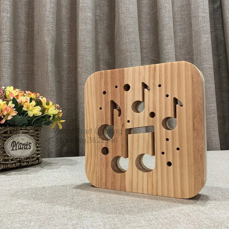 Square pine wood USB LED atmosphere lamp with warm white light on a surface.