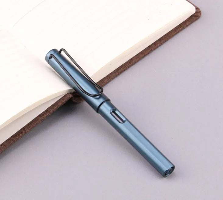 Black and blue frosted ink bag fountain pens with 0.38mm and 0.5mm nib options on a notebook.