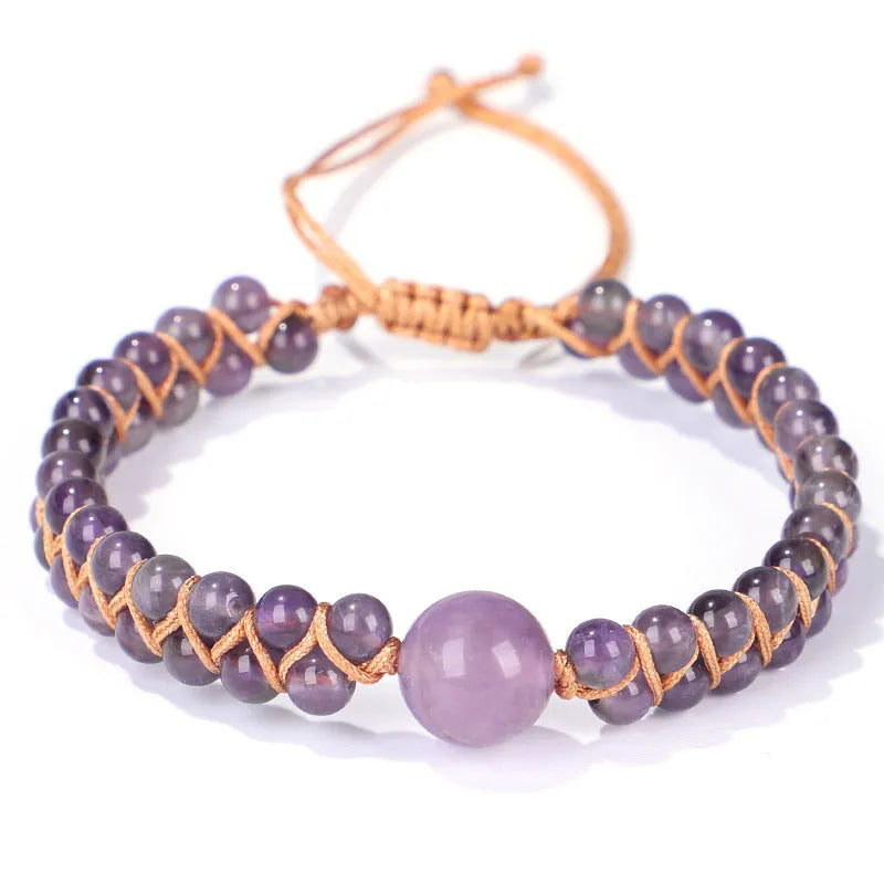 Close-up of a handmade woven pull bracelet with geometric pattern in blue Tigereye stone beads.