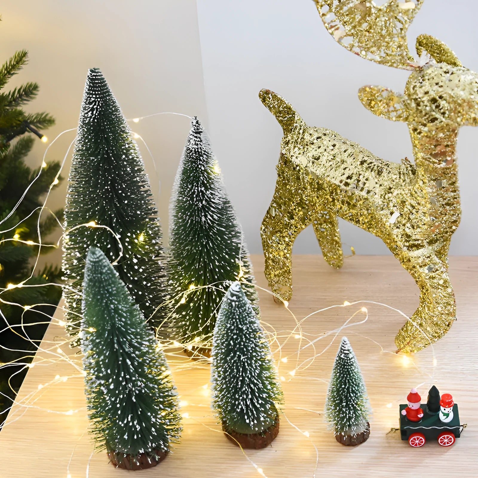 Miniature Christmas pine needle tree decoration in green and white, available in 10cm to 25cm heights