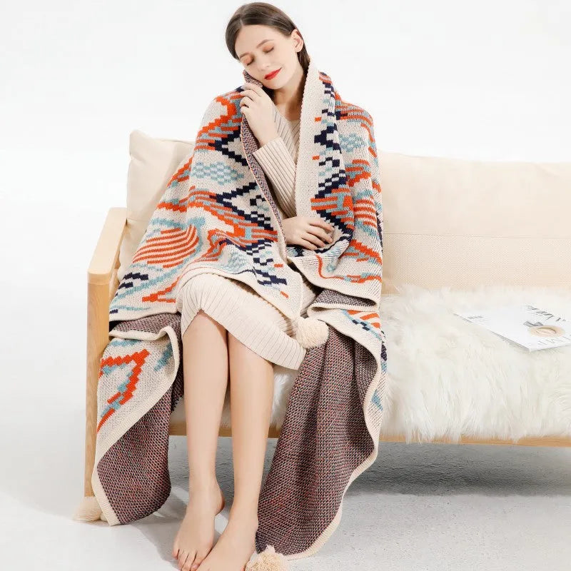 Bohemian-style acrylic sofa cover blanket with tassel trim in a geometric pattern colour option