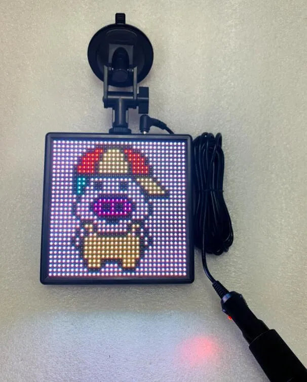 Square LED car display screen with aluminium frame for wireless Bluetooth content updates.