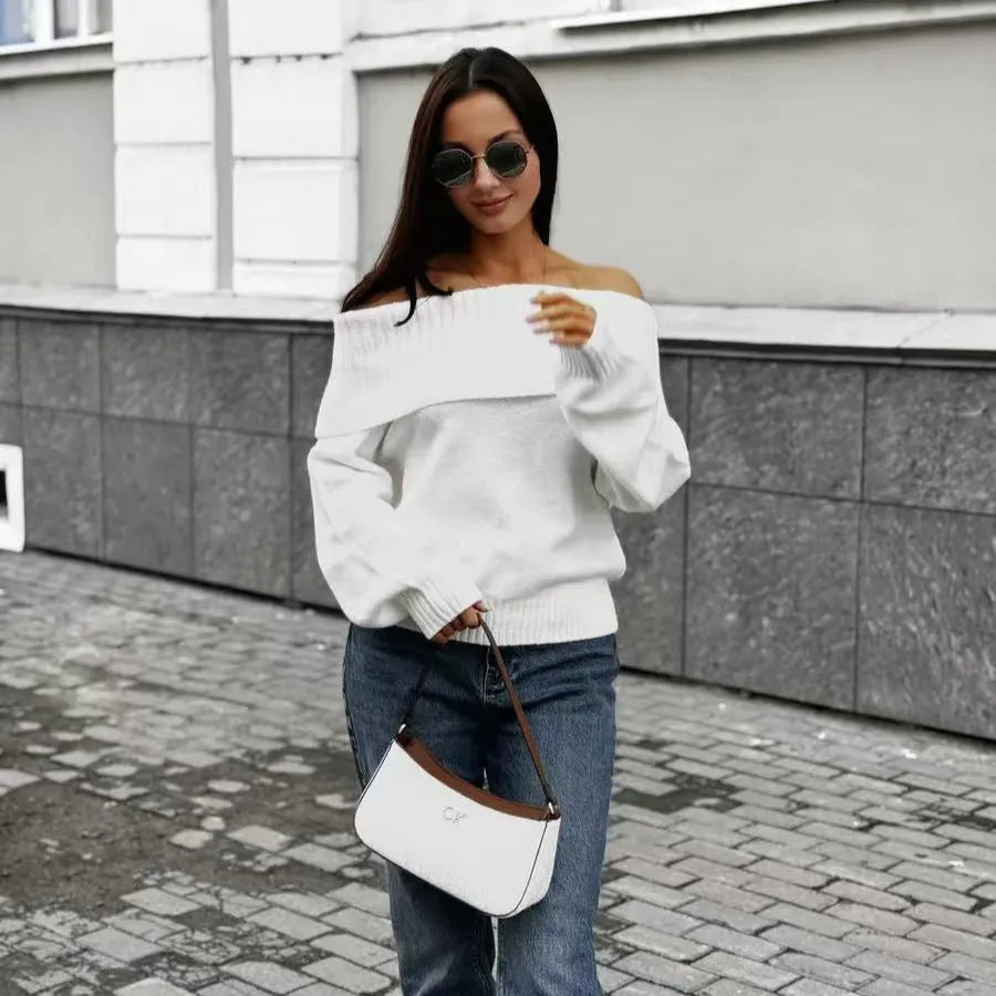 Grey off-the-shoulder strapless sweater with a raised 3D pattern texture.