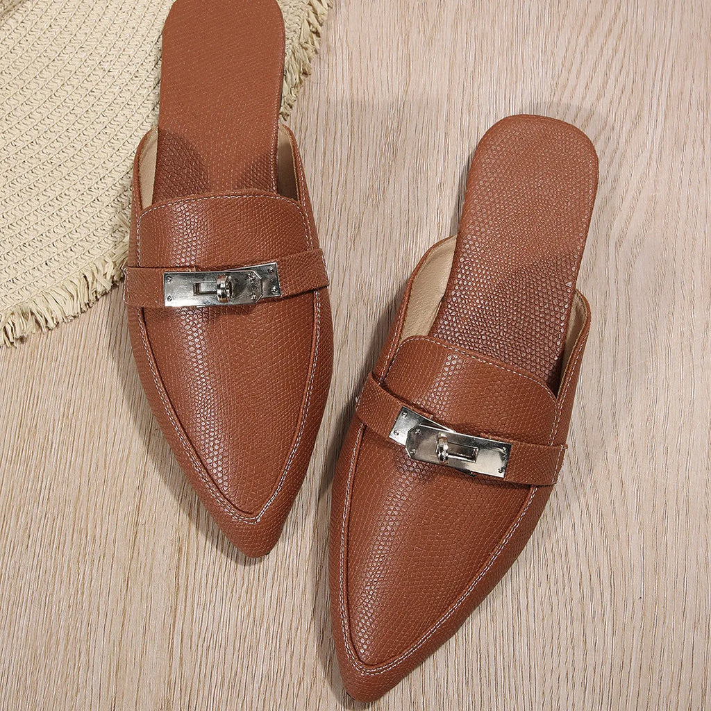 Light brown women's pointed-toe slippers with low heel design on white background