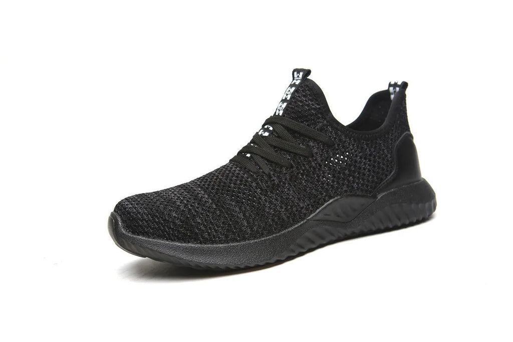 Black work safety shoe with steel toe cap and EVA sole on a grey background