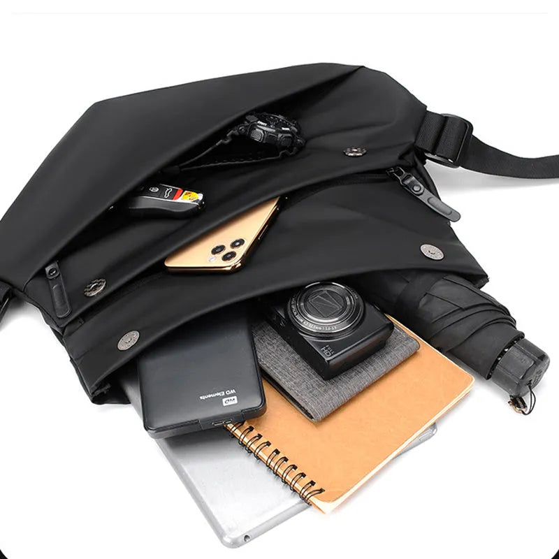 Men's grey medium crossbody bag with shoulder strap showing internal phone and document pockets
