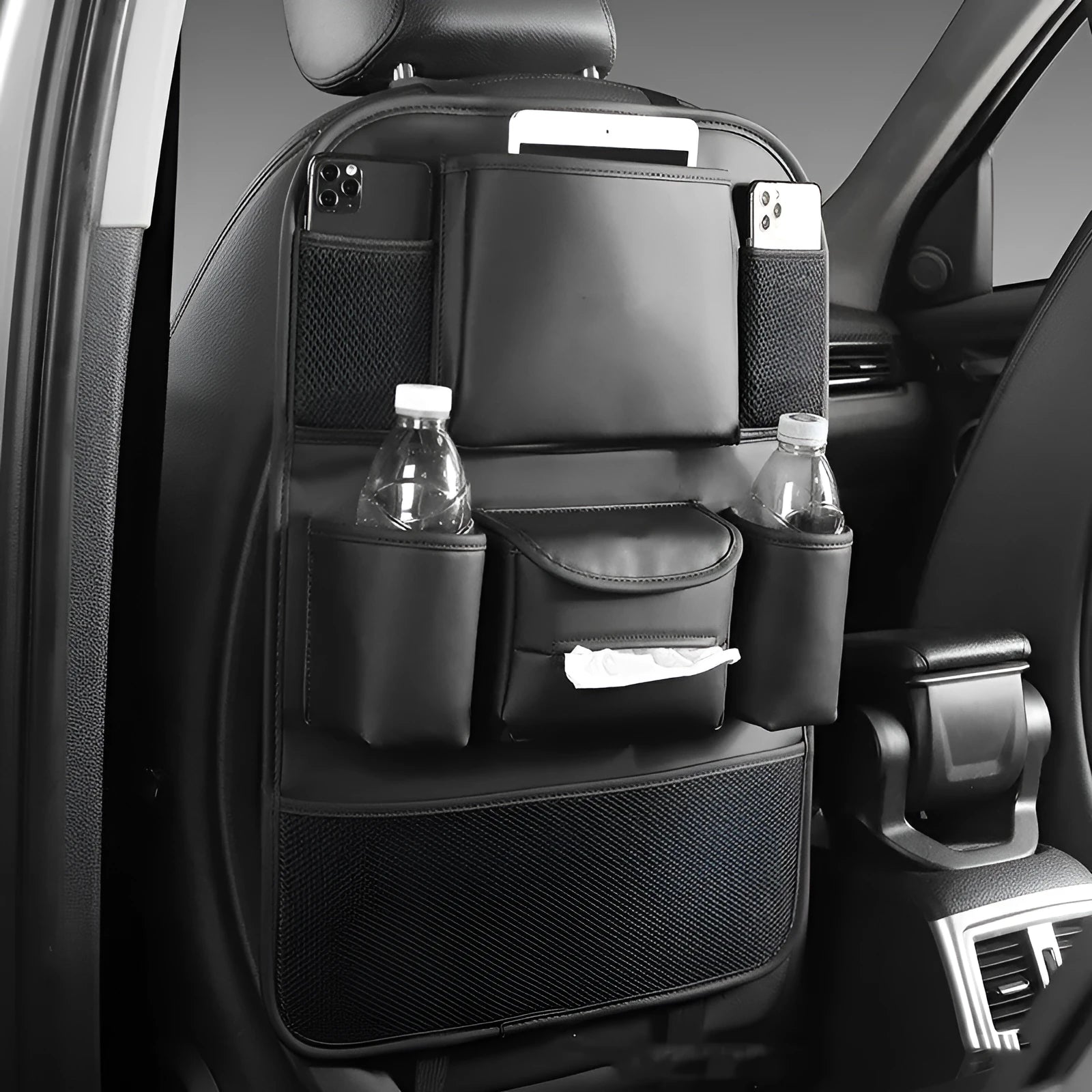 Leather car seat back storage bag mounted behind a car seat in a choice of black, brown, green, or grey.