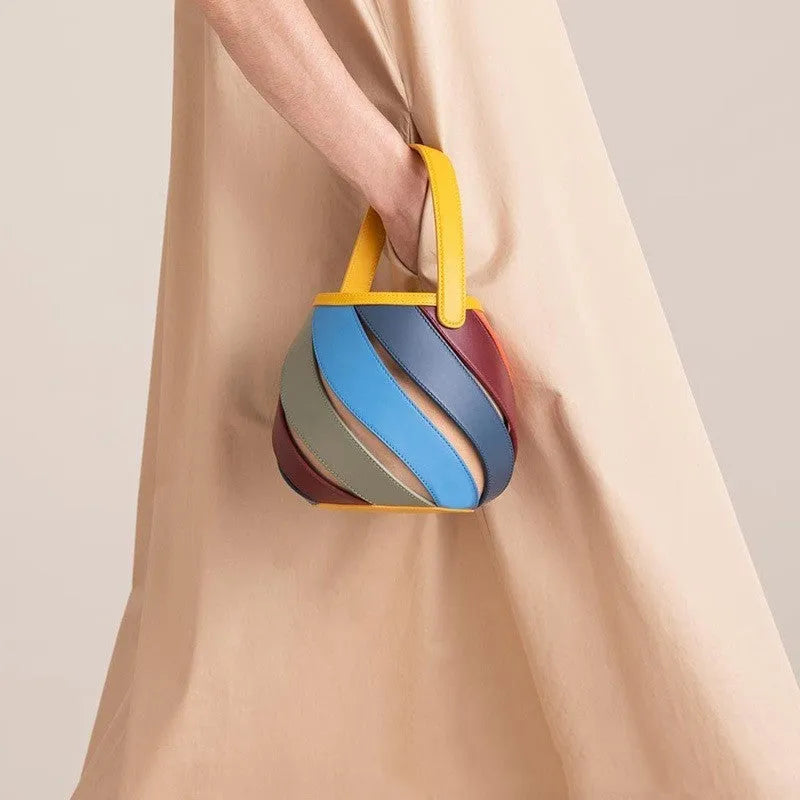 Cylindrical diamond quilted bucket bag in beige with contrast stitching