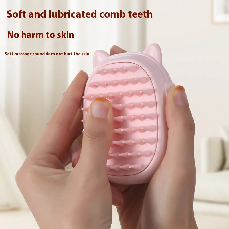 Yellow plastic pet comb with integrated laser pointer for cat grooming and play