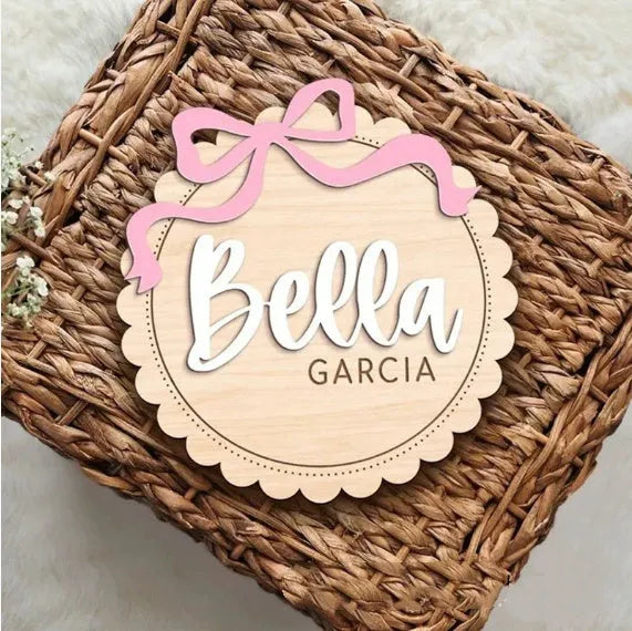 Square wooden baby room decoration ornament with a personalised name engraved in the centre.