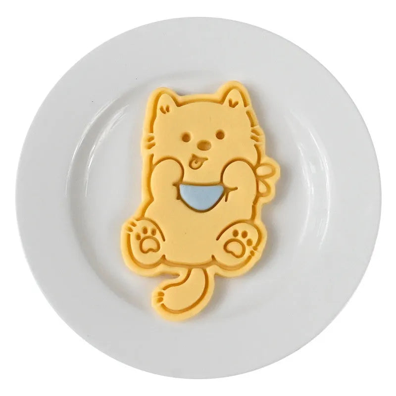 Three-dimensional plastic biscuit mould for making puppy-themed cookies with seven dog cartoon designs