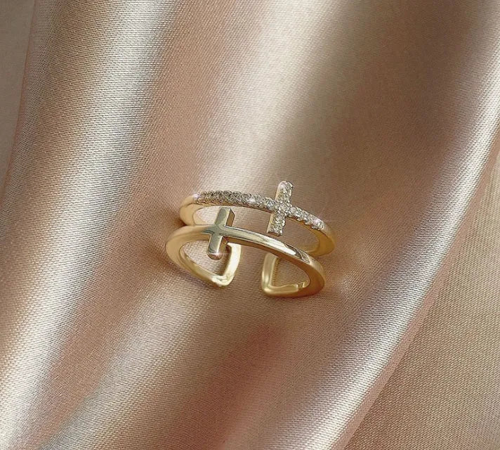 Adjustable copper women's ring with double cross design, zircon stones, and sterling silver inlay in white gold finish.