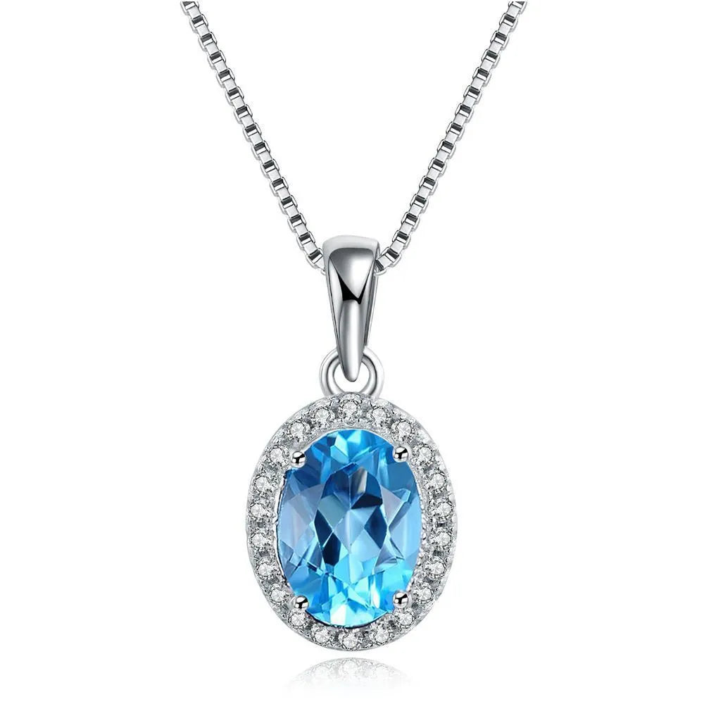 925 sterling silver jewellery set with blue topaz gemstones showing earrings, ring, pendant and necklace