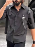 Men's black utility-style button-up shirt with a regular fit