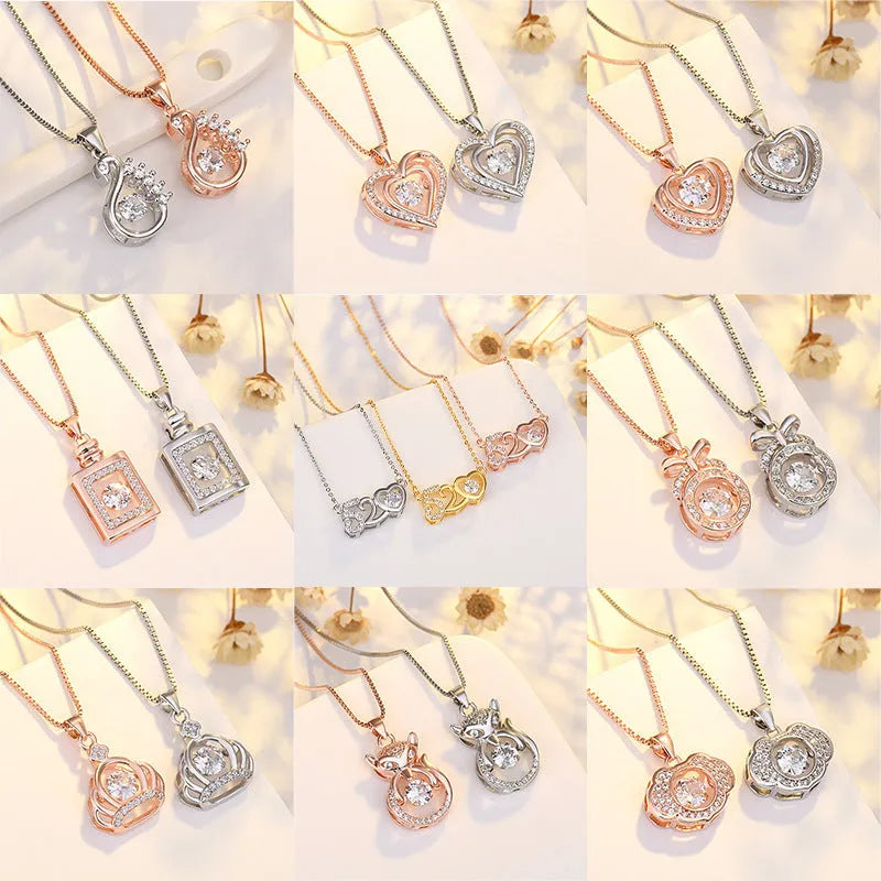 Sterling silver heart-shaped pendant necklace with crown and bow detail in rose gold or silver finish
