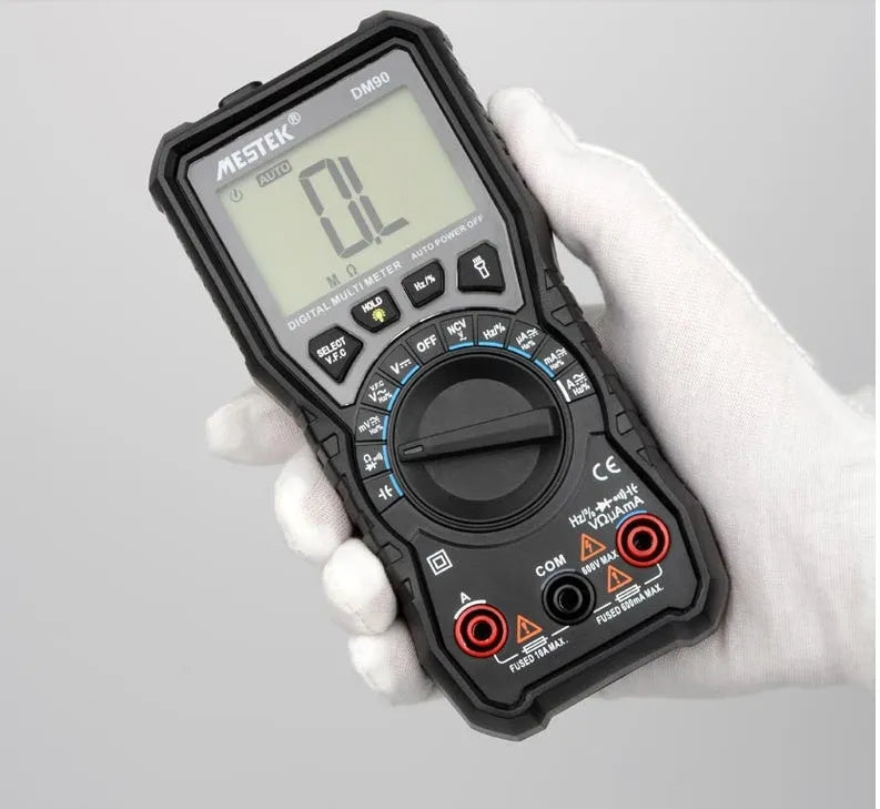 DM90A digital multimeter with test leads showing 6000-count display and temperature measurement function