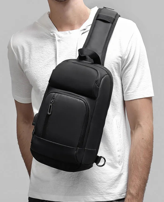 Black PVC outdoor leisure shoulder bag with air cushion strap and internal organiser pockets
