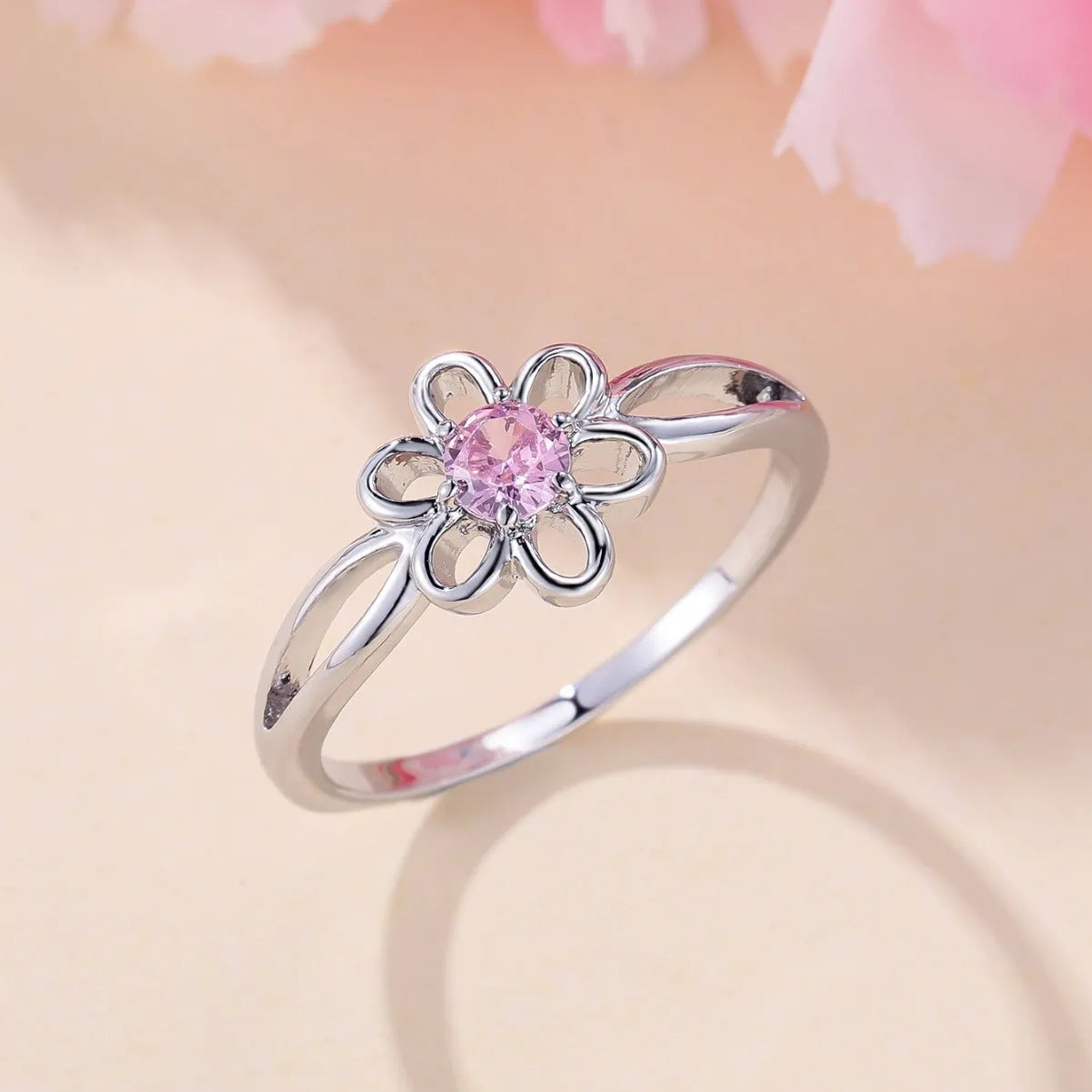 Copper fashion ring with hollowed flower design in platinum pink diamond colour