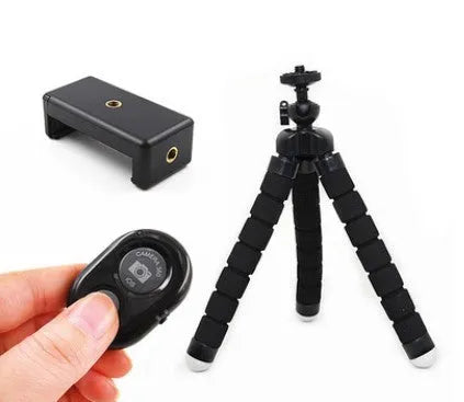 Black flexible octopus tripod wrapped around pole holding smartphone