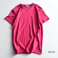 Men's solid colour cotton t-shirt on a hanger, showing round neck and short sleeve design.