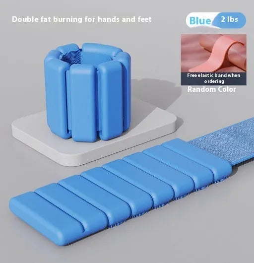 Silicone wrist weight bracelet with Velcro strap in blue, shown detached.