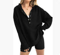 A peacock green women's loose-fit sweater with raglan long sleeves, laid flat.