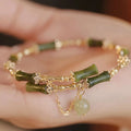 Women's plum wine coloured bamboo beaded bracelet with coloured glaze construction