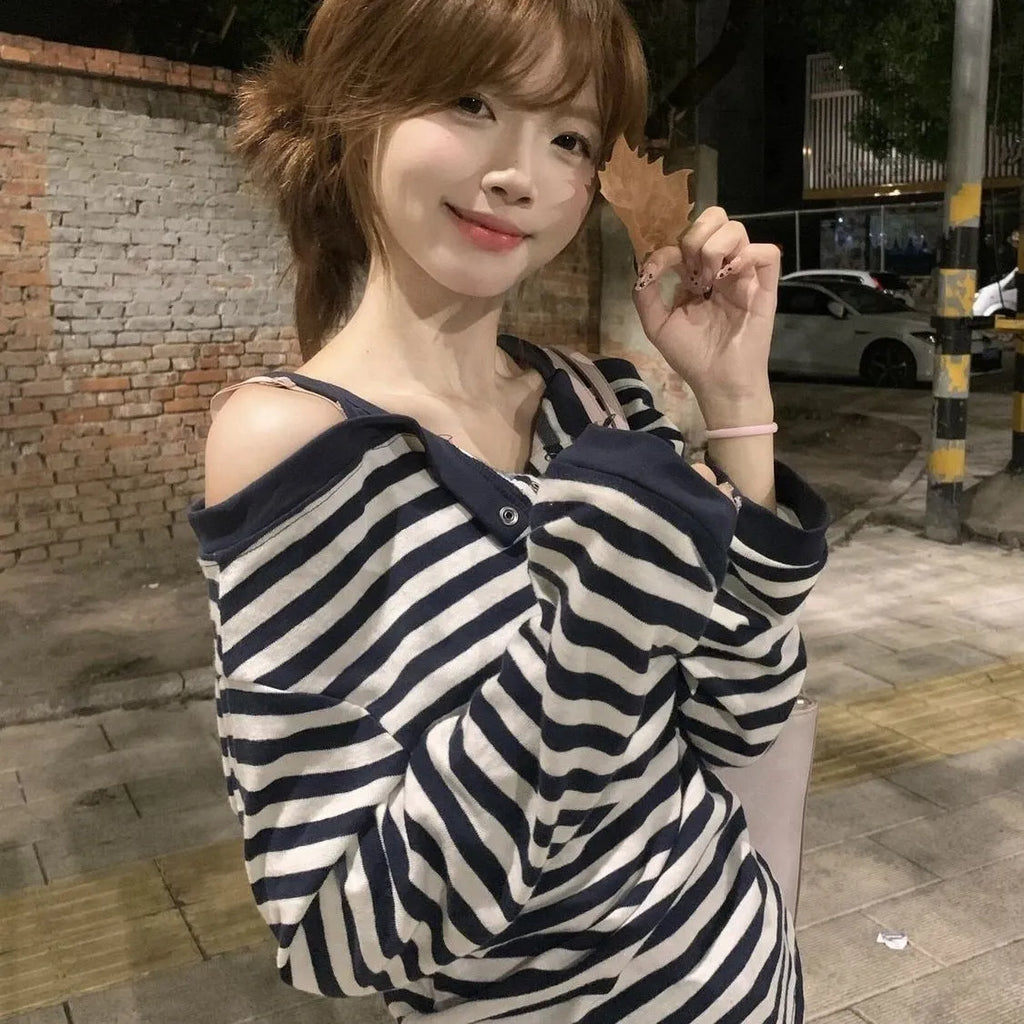 Dark blue Korean-style oversized women's long-sleeved t-shirt with stripes and embroidery detail.