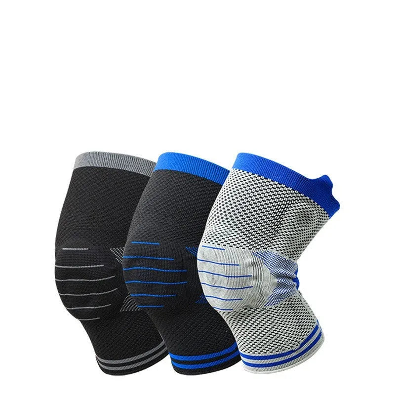 Cotton knee pad with silicone massage spring bar shock absorber in a black and blue colour combination.
