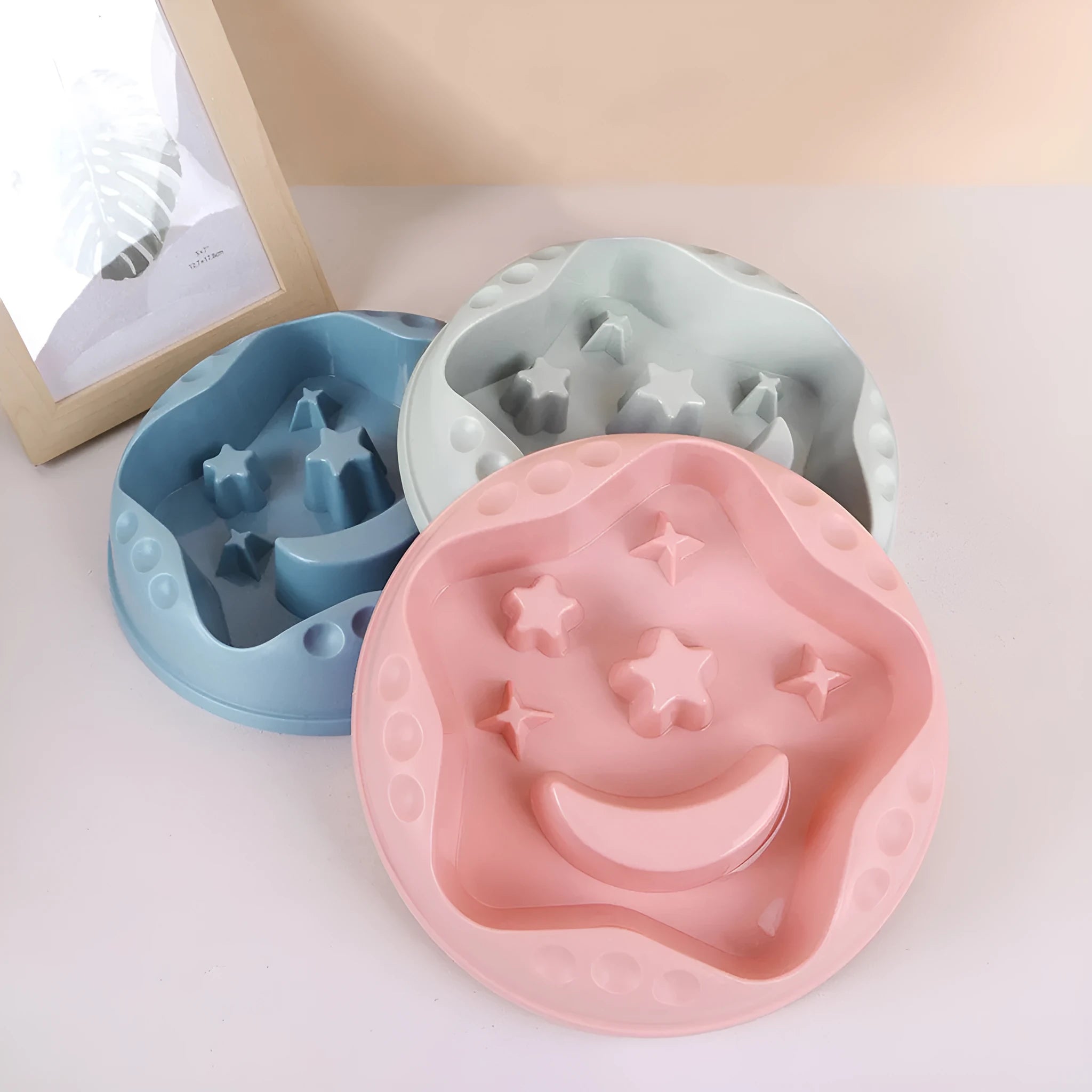 Moon star wings design slow feeder pet bowl in assorted colours on a non-slip base.