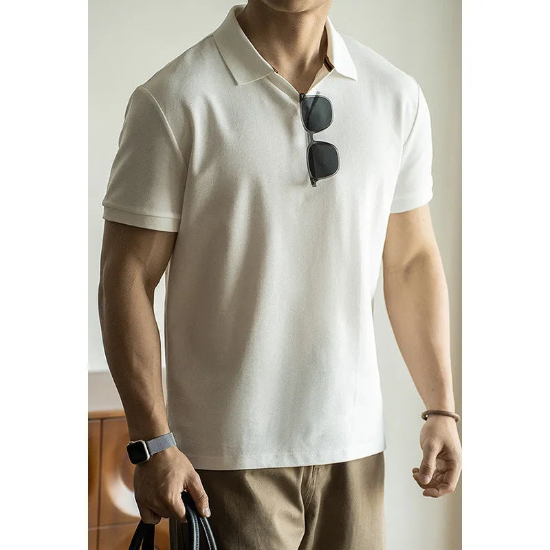 Blue short-sleeved cotton blend polo shirt on a hanger, showing regular fit and button placket.