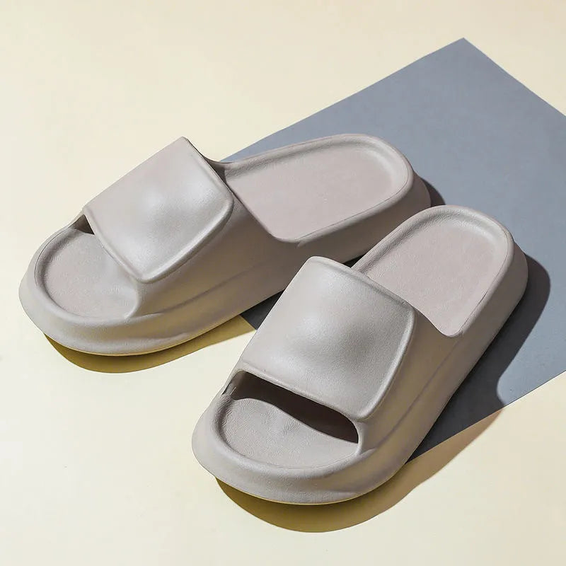 Pair of thick-soled EVA foam slippers in a choice of seven colours, showing non-slip textured sole.